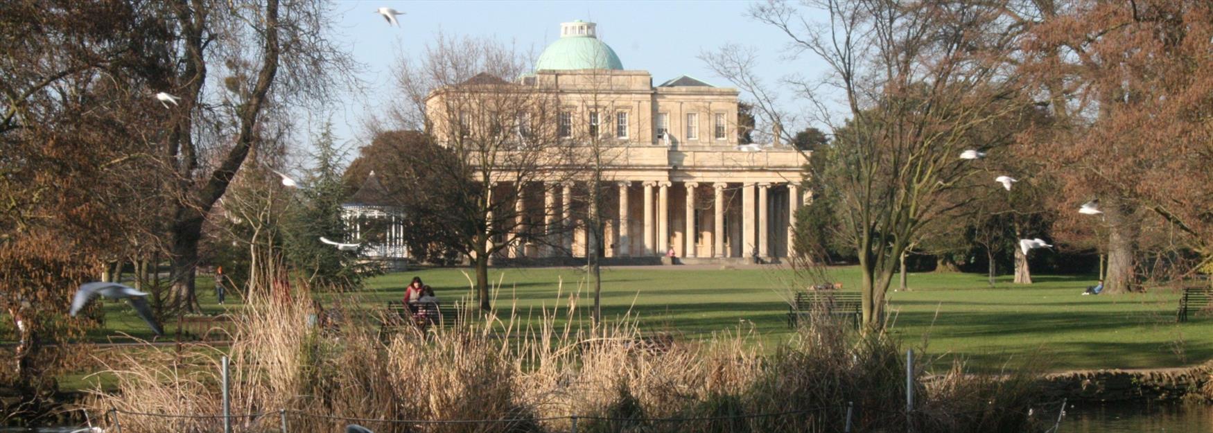 Looking towards Pittville Pump Room through Pittville Park