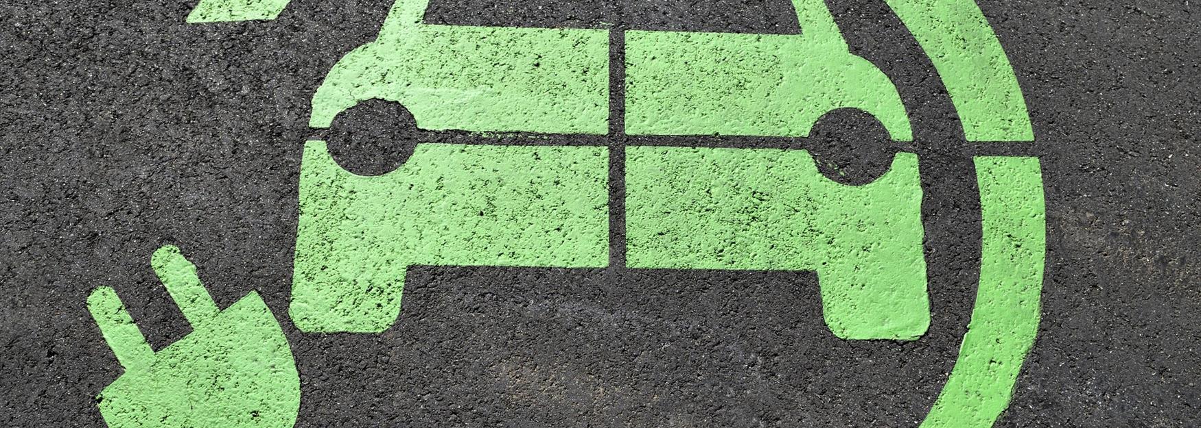 Close up of an electric car charging floor stencil