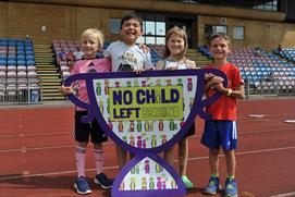 Children holding a NCLB banner