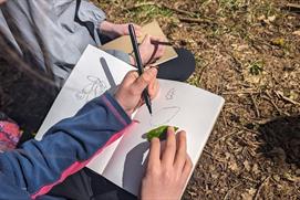 Person drawing outdoors