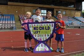 Children holding a NCLB banner