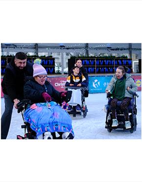 Wheelchair users enjoying the Cheltenham Ice Rink