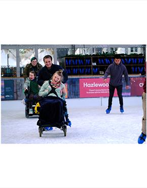 Wheelchair users enjoying the Cheltenham Ice Rink