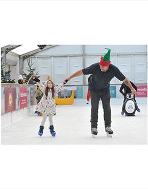 A father and daughter at the Cheltenham Ice Rink