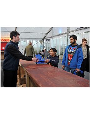 A young boy getting his skates at the Cheltenham Ice Rink