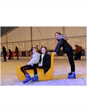 A child with a rideable skate aid at Cheltenham Ice Rink