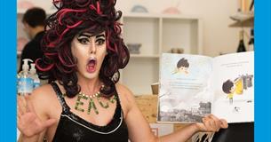 A drag queen reading a story book