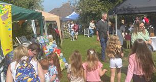 Friends and families enjoying market stalls.