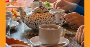 Table setting with a teapot and cup and saucer