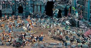 Scene filled with Warhammer models.