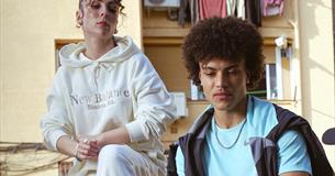 A man and a woman wearing JD sportswear