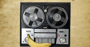 A vintage recorder and a banana