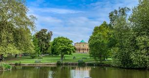 Pittville Pump Room Cheltenham across the lake