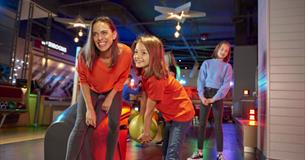 Family enjoying bowling