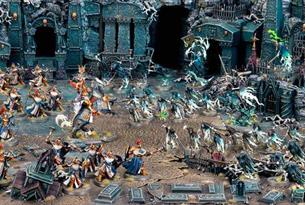 Scene filled with Warhammer models.