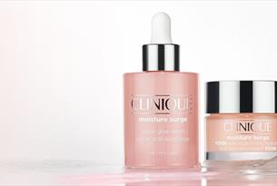 Clinique moisture surge serum bottle next to clinique moisture surge bottl

