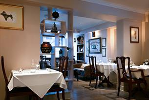 Interior tables and chairs at East India Cafe