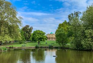 Pittville Pump Room Cheltenham across the lake