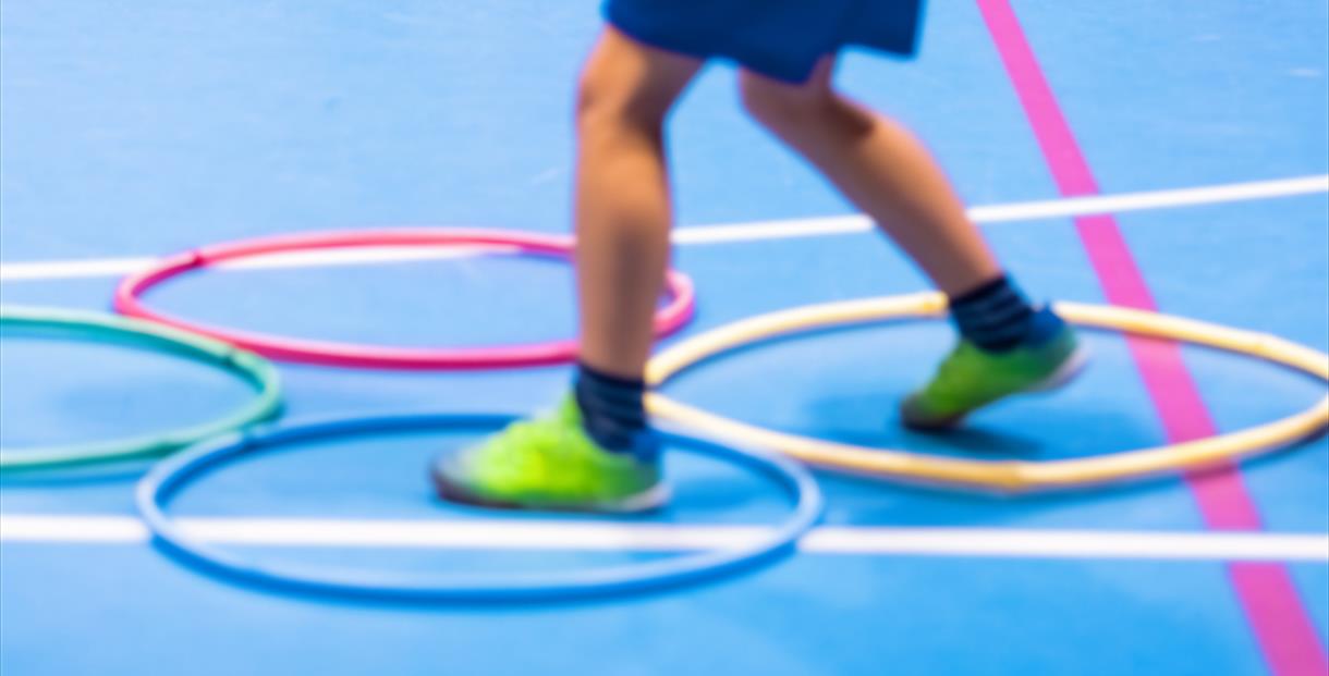 Children playing in a sports hall