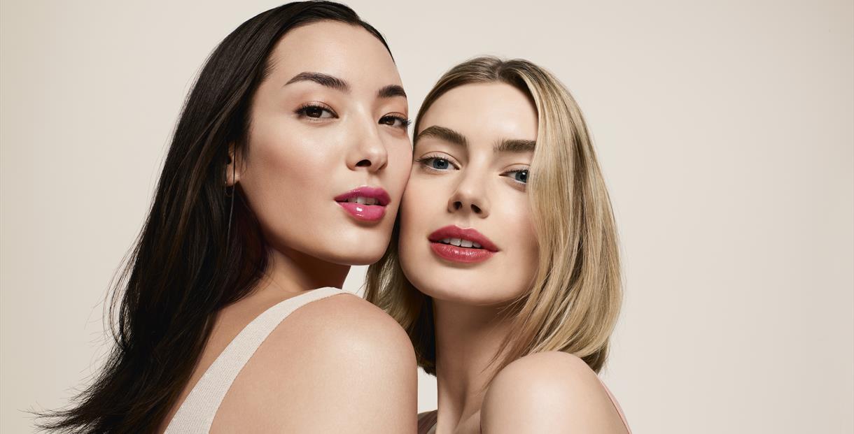 Two model close up showcasing clarins lip oil