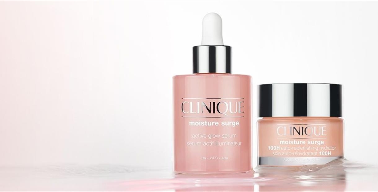 Clinique moisture surge serum bottle next to clinique moisture surge bottl
