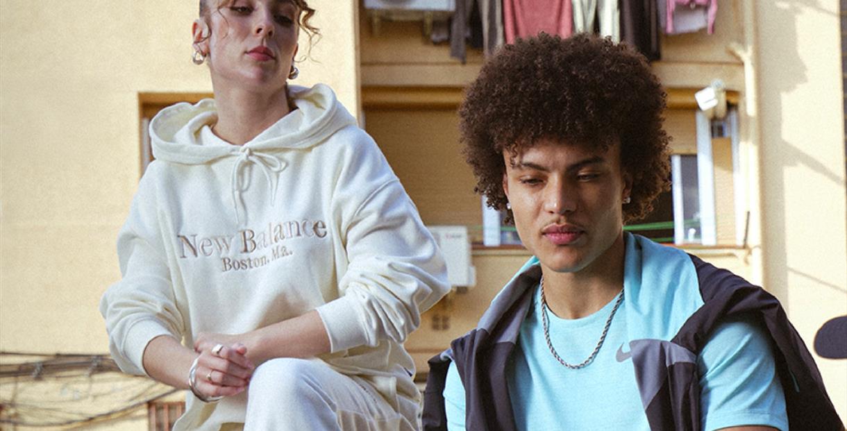 A man and a woman wearing JD sportswear