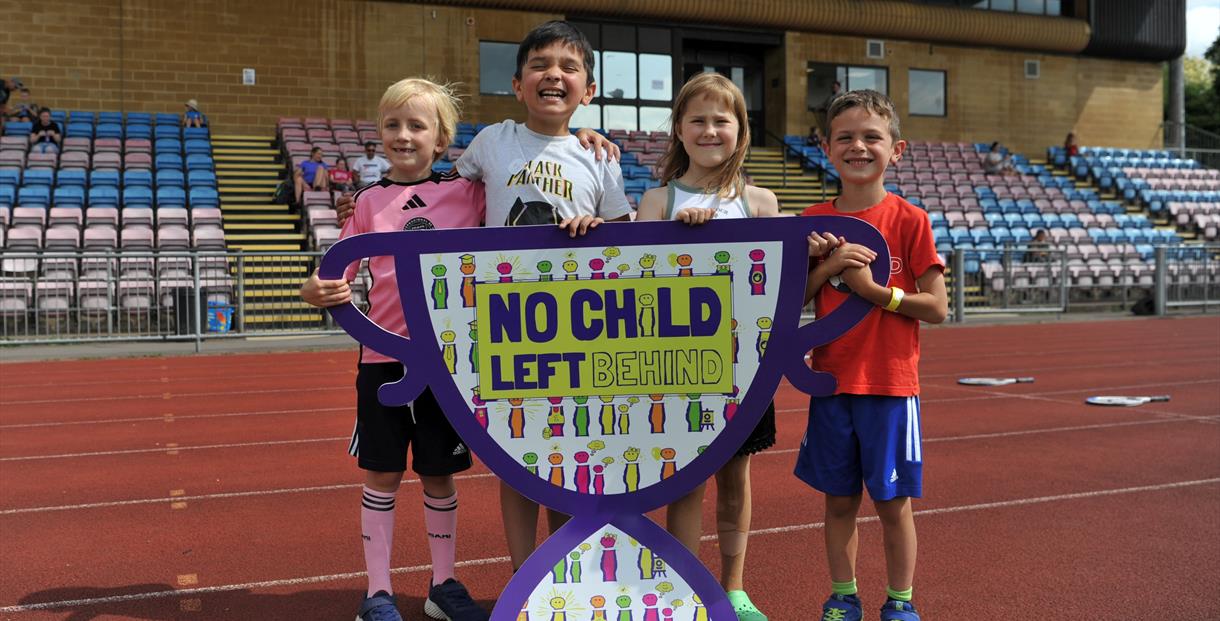 Children holding a NCLB banner