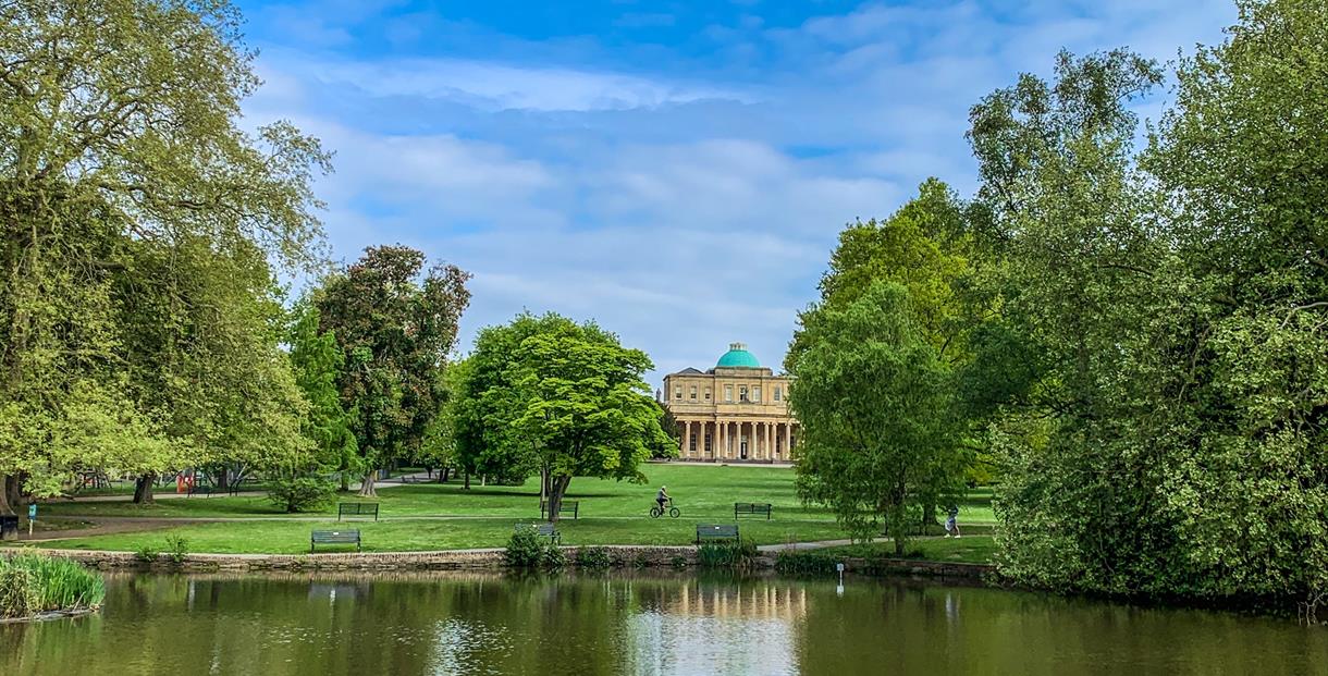 Pittville Pump Room Cheltenham across the lake