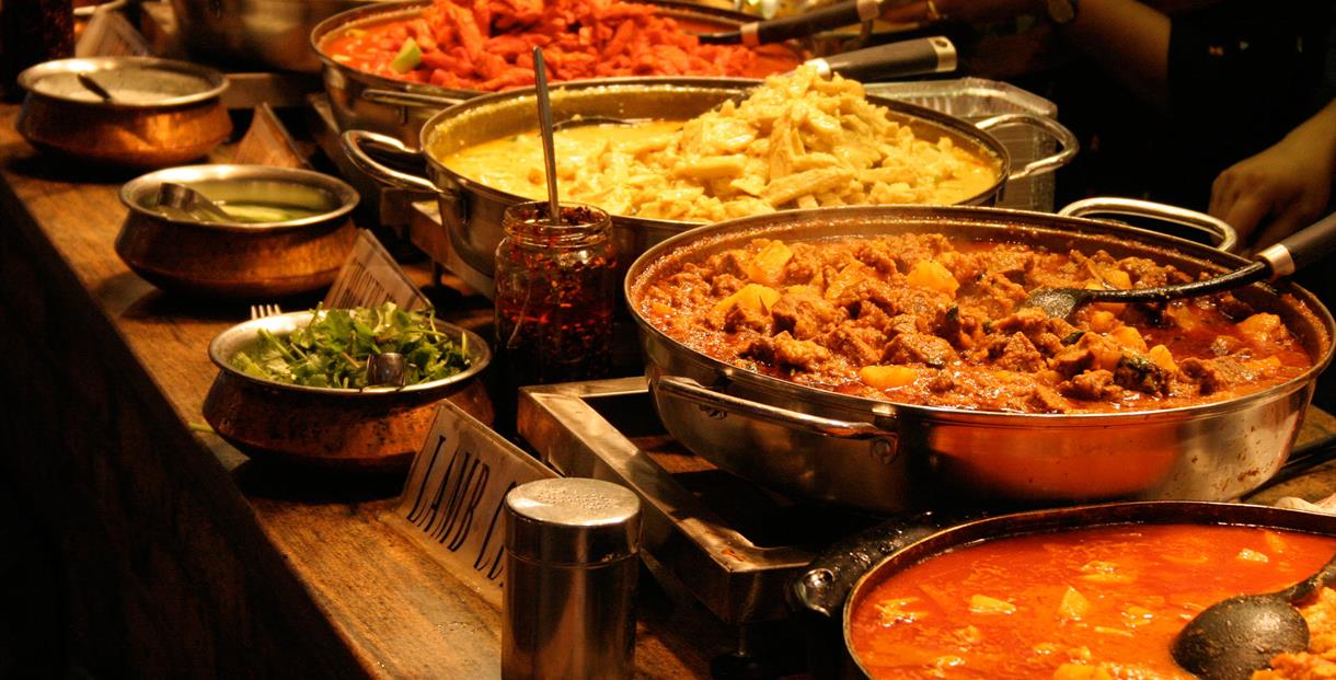 A line of curry dishes