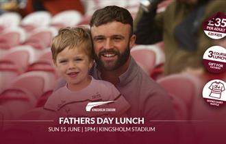 Image of father and son looking happy