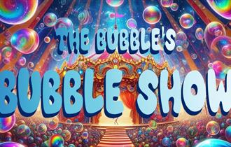 A colourful picture of bubbles amongst a theatre tent