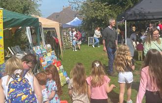 Friends and families enjoying market stalls.