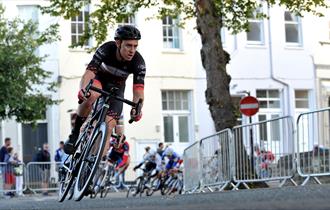 A man riding a bike in Cheltenham