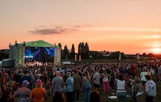 A sunset and stage at Cheltenham Racecourse