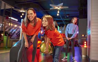 Family enjoying bowling