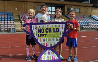 Children holding a NCLB banner