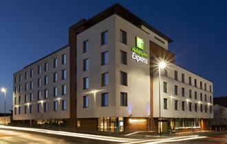 Exterior of Holiday Inn Express in the evening