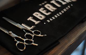 Libertine towel with barber scissors