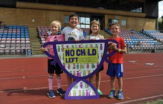 Children holding a NCLB banner