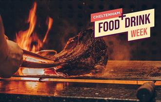 A steak searing on an open flame