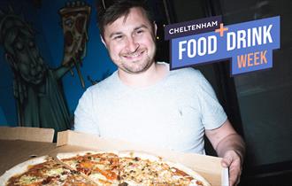 A customer enjoying Slice Bros pizza