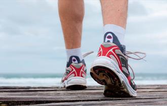 A pair of feet in trainers