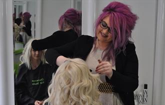 Lady having her hair cut