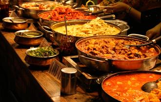 A line of curry dishes