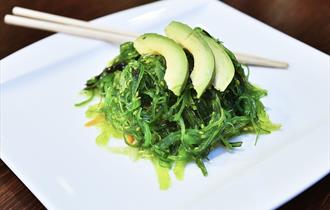 A plate of prepared seaweed and avocado