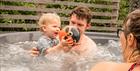 Family enjoying lodge hot tub