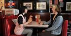 A couple drinking milkshakes at Smokey Joes