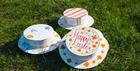 Colourfully decorated Easter bonnets resting on gras