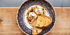 Turkish poached eggs on a grey plate