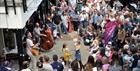 Live performance and crowds at Montpellier Courtyard.